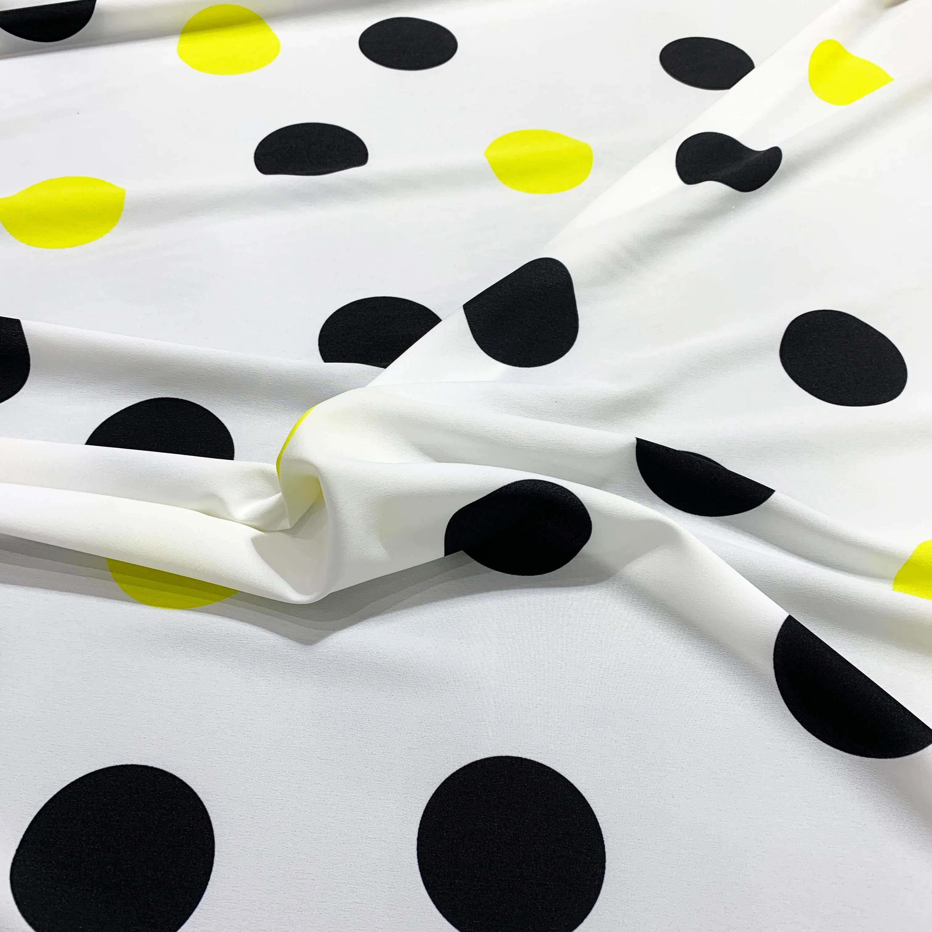 Black and Yellow Polka Dots on a White Background Printed Polyester Fabric